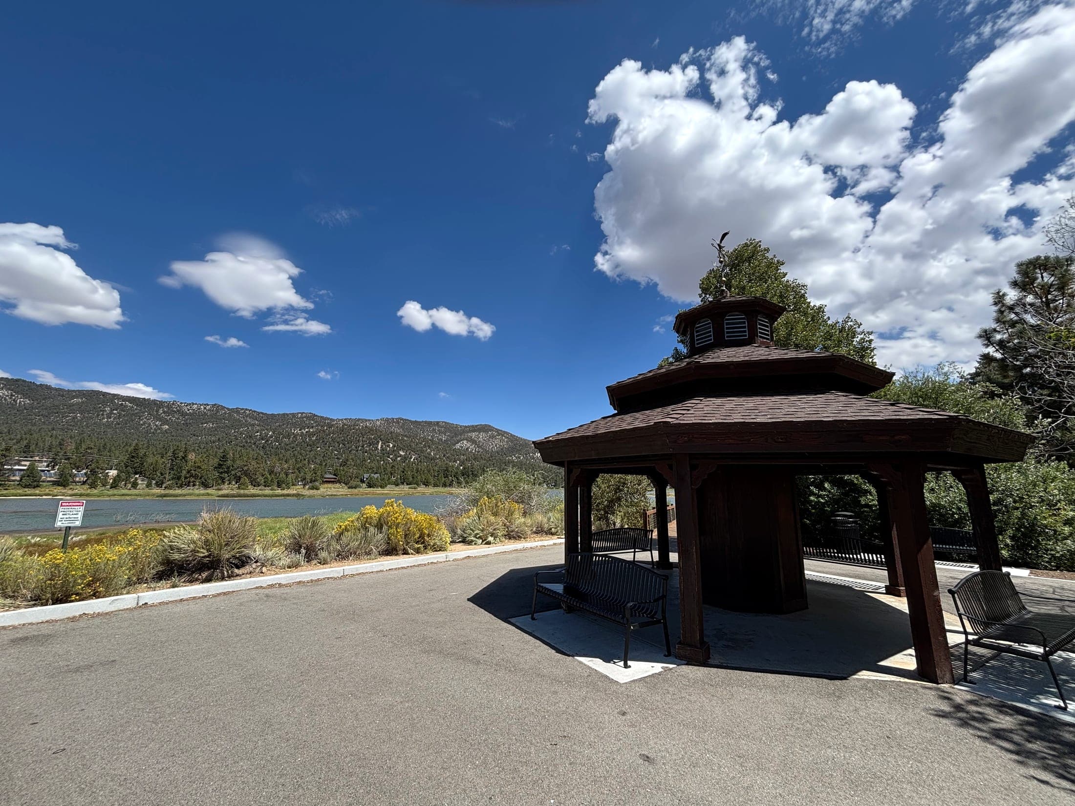 Park gazebo overlooking Big Bear Lake and pine-covered mountains in Southern California