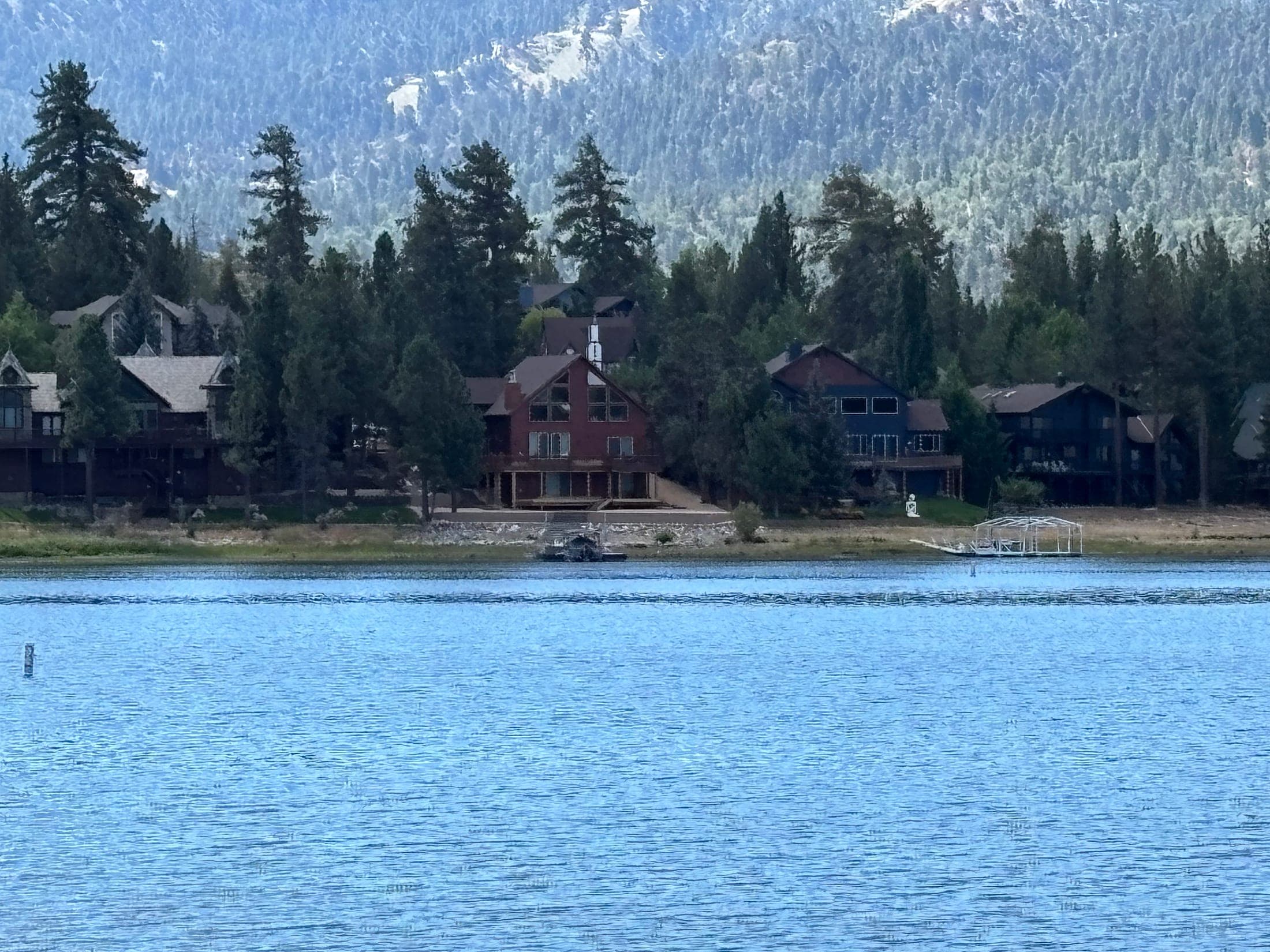 Lakeside mountain homes and docks along Big Bear Lake, a community shoreline view not a specific listing