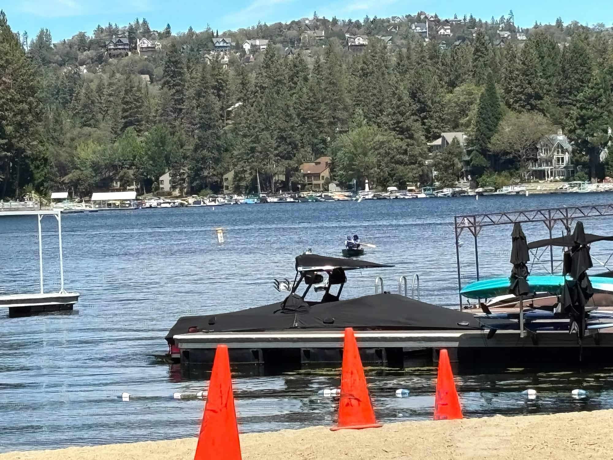 Lake Arrowhead California lake, docks, and forested mountain homes on the far shore.