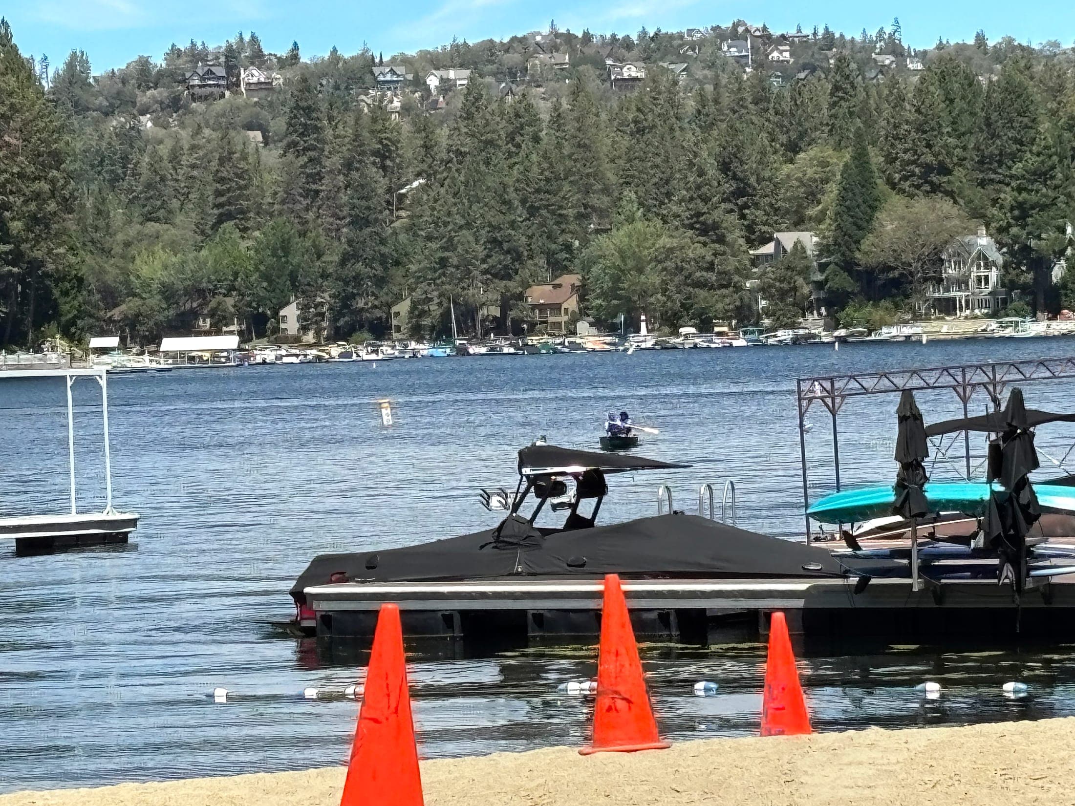 Lake Arrowhead California lake, docks, and forested mountain homes on the far shore