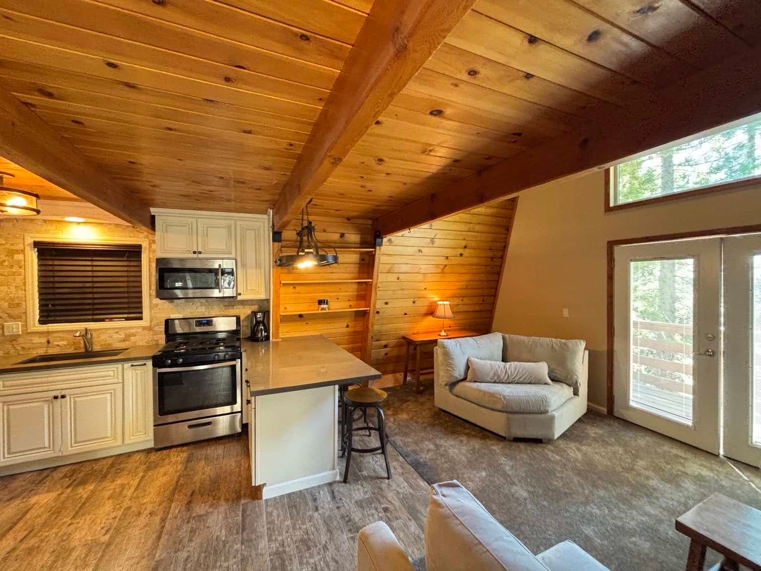 Updated kitchen with quartz counters opening to the living area at 30975 Knob Hill Circle