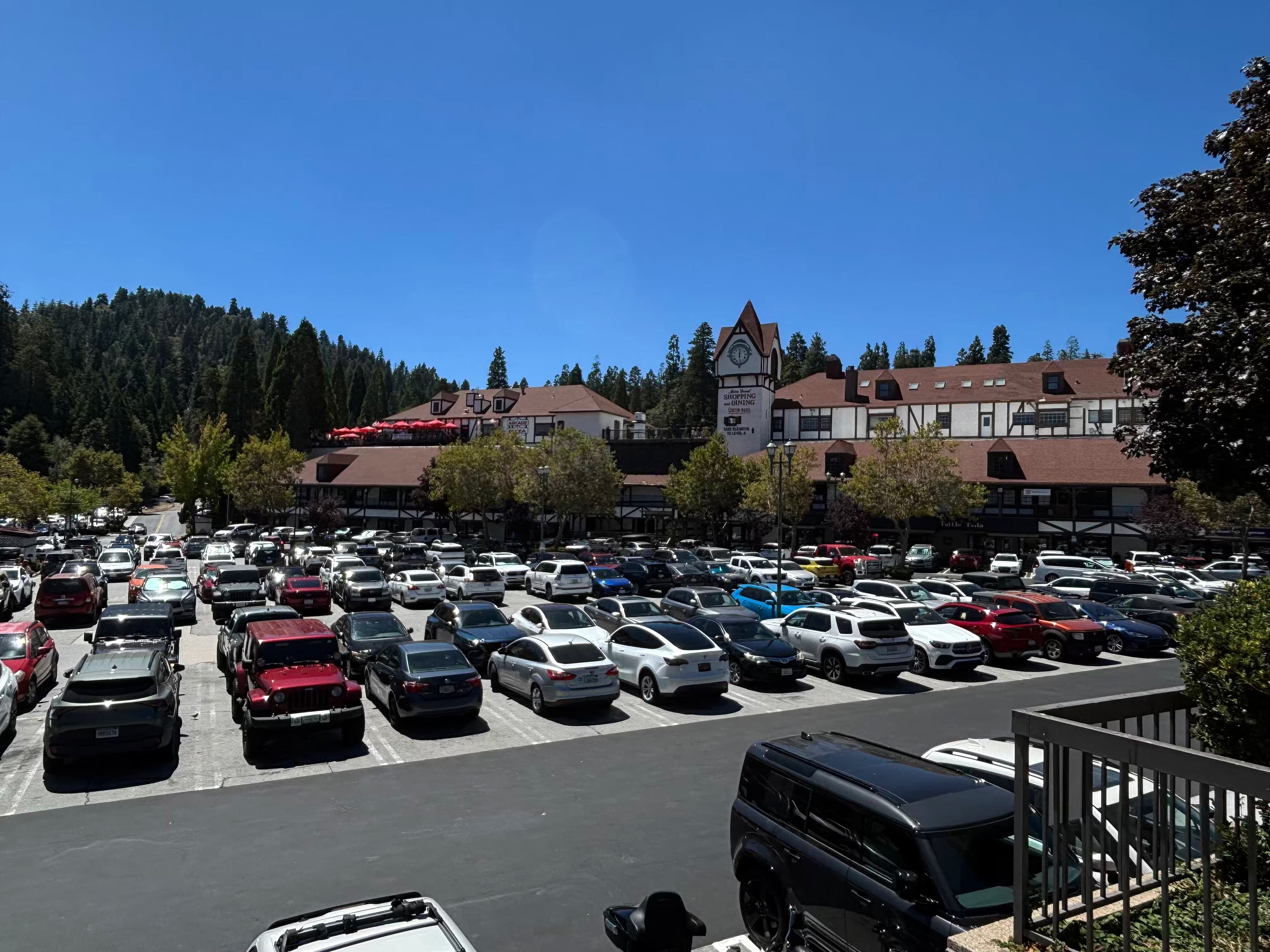 Lake Arrowhead Village parking lot with Tudor shops and clock tower