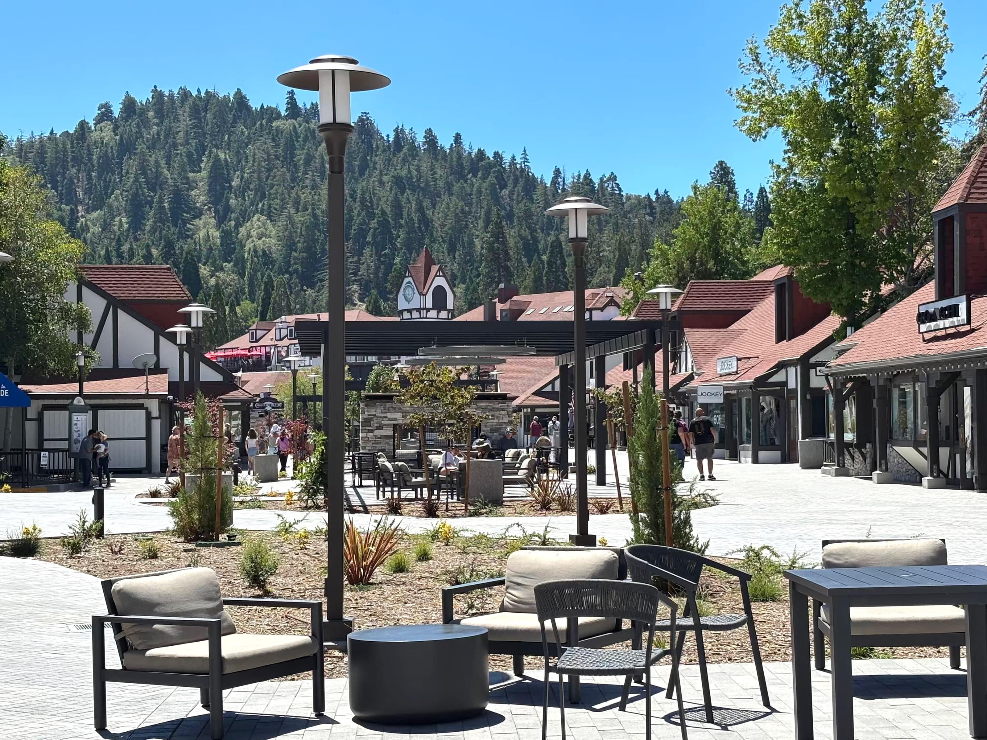 Lake Arrowhead Village plaza seating with Tudor shops and clock tower