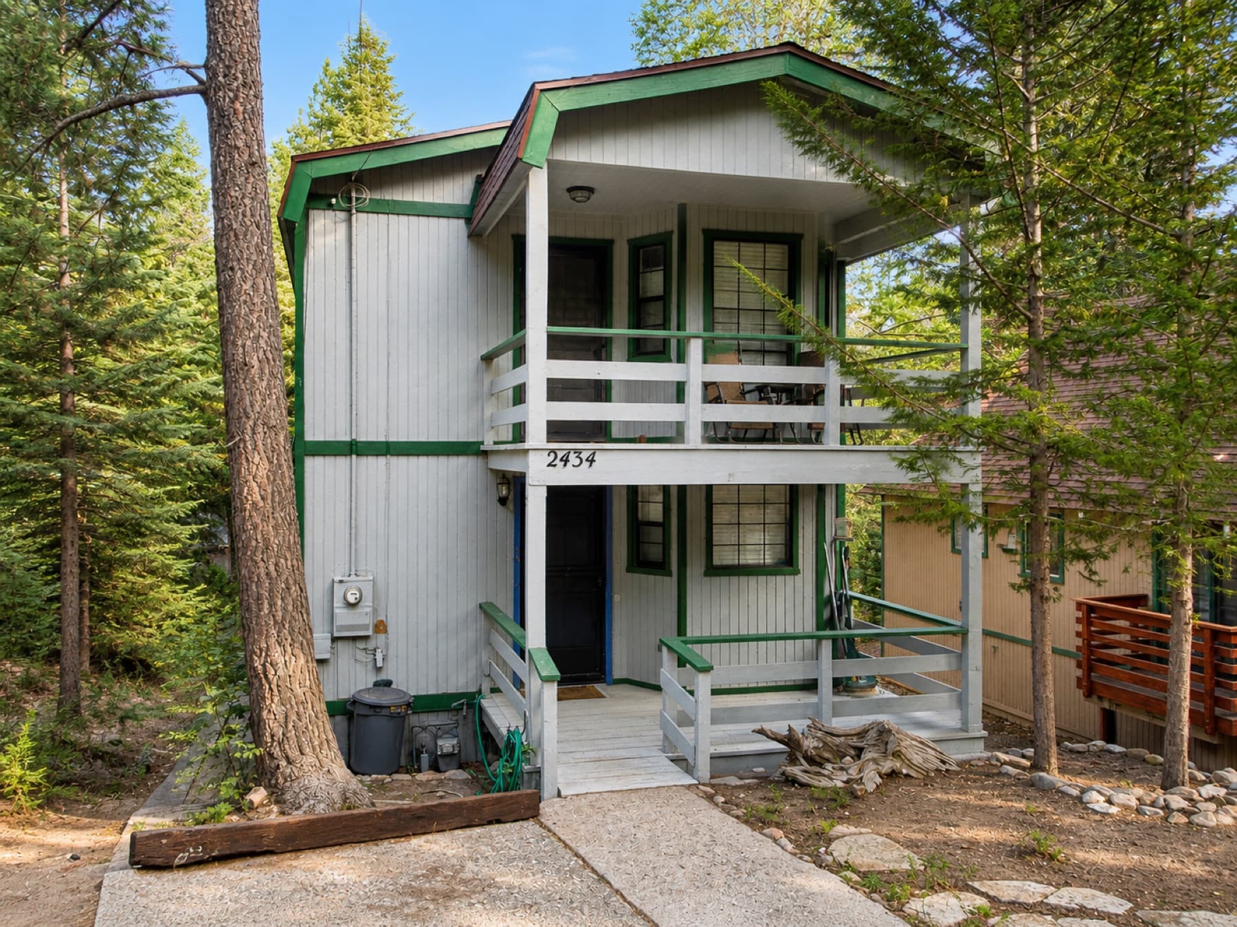 Front path and stairs leading to the door of a house on Fir Drive in Running Springs.