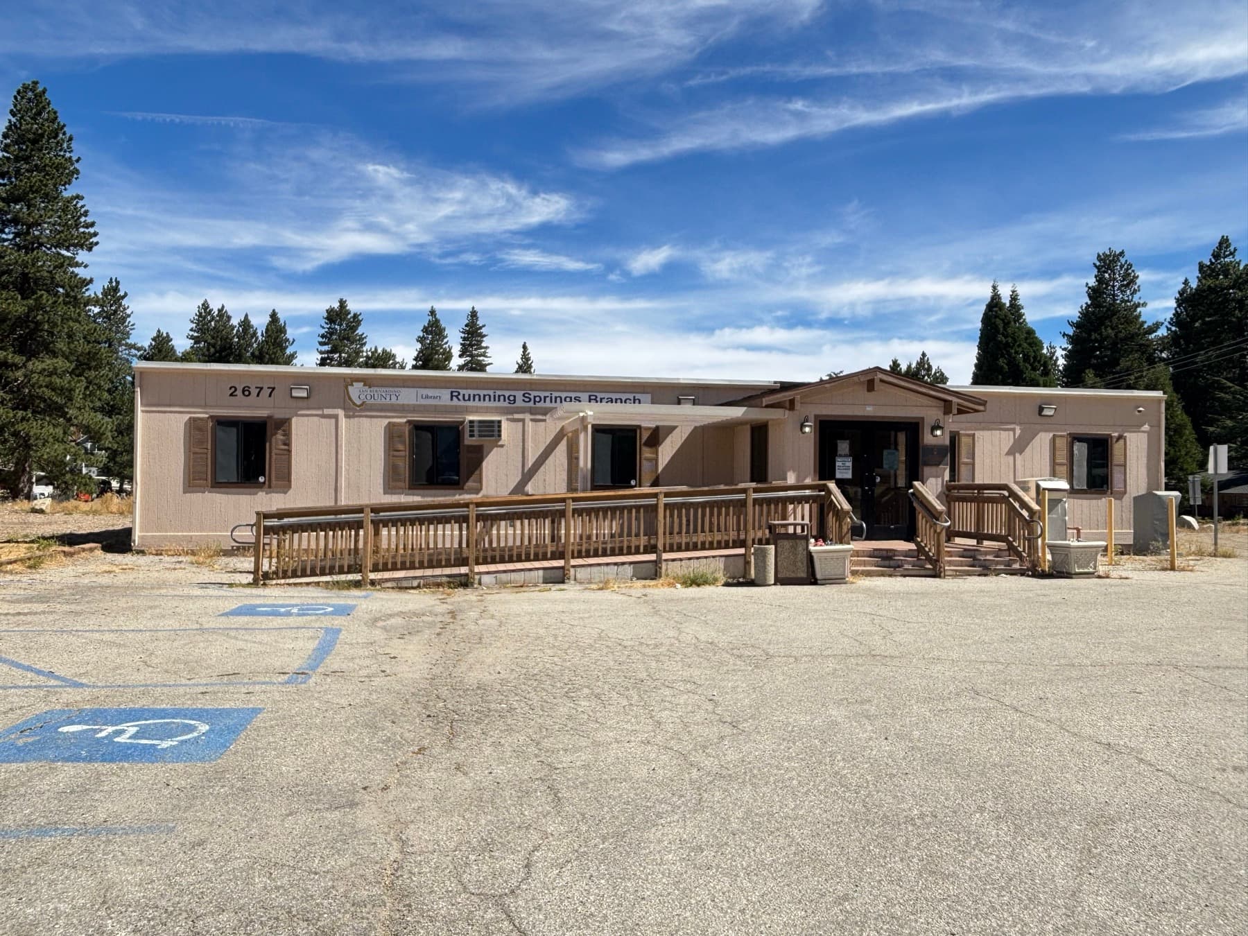 San Bernardino County Library Running Springs branch building among pine trees